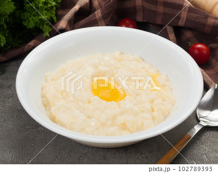 rice porridge with milk and butter in a white plate 102789393