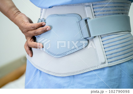 Asian lady patient use walker in hospital to support walking. 102790098