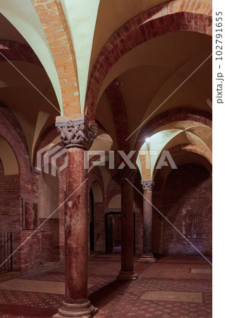 Architectural detail with arches and pillars inside Santo Stefano complex, part of Sette Chiese, the Seven Churches in Bologna, Italy. Architectural detail with arches and pillars inside Santo Stefano complex, part of Sette Chiese, the Seven Churches in Bologna, Italy. 102791655