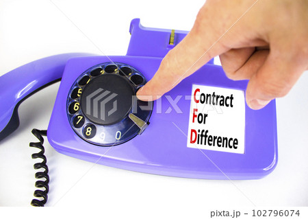 CFD symbol. Concept words CFD contract of difference on beautiful old disk phone. Businessman hand. Beautiful white table white background. Business and CFD contract of difference concept. Copy space. CFD symbol. Concept words CFD contract of difference on beautiful old disk phone. Businessman hand. Beautiful white table white background. Business and CFD contract of difference concept. Copy space. 102796074
