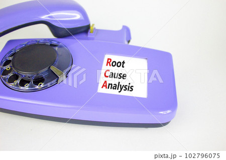RCA root cause analysis symbol. Concept words RCA root cause analysis on beautiful old disk phone. Beautiful white table white background. Business and RCA root cause analysis concept. Copy space. 102796075
