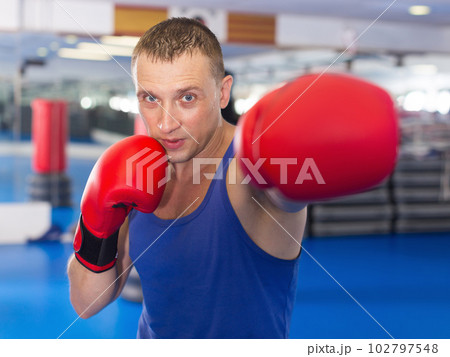 Adult male who is training in professional box gym Adult male who is training in professional box gym 102797548