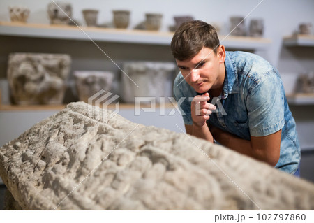 Man looking at exhibits in Ancient Greek hall 102797860