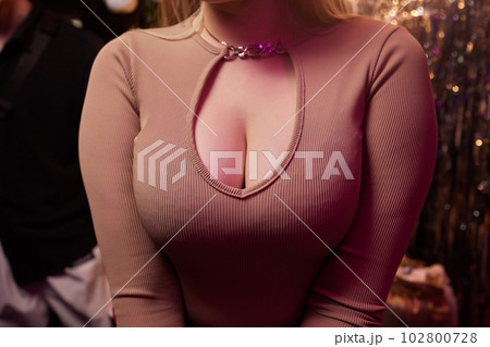 Decollete, female breast. Neckline dress and fur collar. Decollete, female breast. Neckline dress and fur collar. 102800728