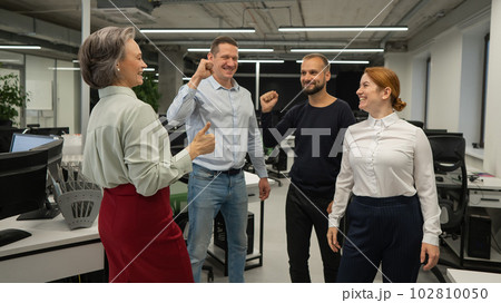 Four colleagues rejoice in success in the office. Four colleagues rejoice in success in the office. 102810050