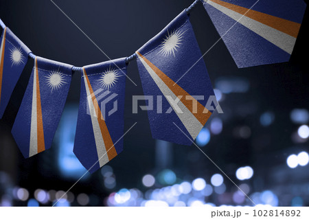 A garland of Marshall national flags on an abstract blurred background A garland of Marshall national flags on an abstract blurred background 102814892