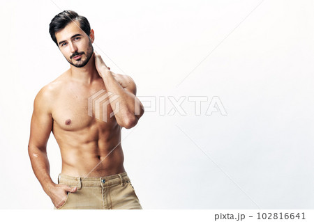 Male athlete model with naked torso and packs of abs sporty on white isolated background, trendy clothing style, copy space, space for text 102816641