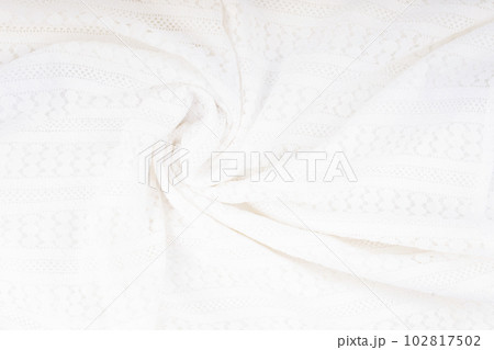 The Lace textile abstract detail on a wedding dress perfect for backgrounds. 102817502