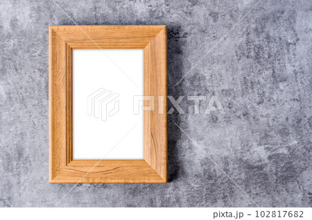 The Empty vintage wooden photo frame isolated on dark wall, Save clipping path for the inside. 102817682