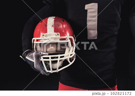 Football player on dark background 102821172