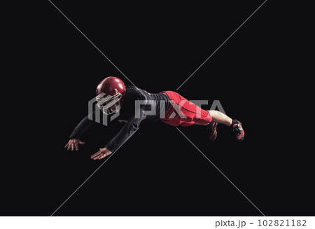Football player on dark background 102821182