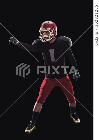 Football player on dark background 102821235