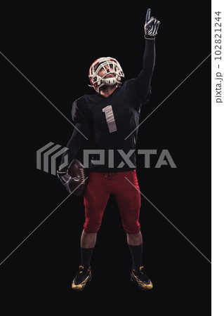 Football player on dark background 102821244