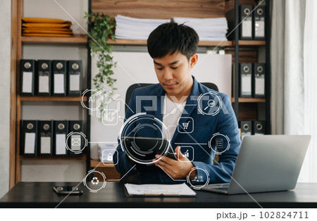 businessman hand working with mobile phone and modern compute with VR icon diagram at office in morning light businessman hand working with mobile phone and modern compute with VR icon diagram at office in morning light 102824711