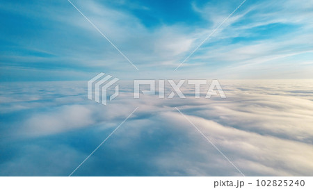Aerial view from a drone flying above the clouds Aerial view from a drone flying above the clouds 102825240