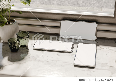 Modern cellphones placed on marble windowsill. 3d render 102825624