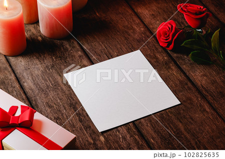 Romantic scene of a blank postcard with rouses and gifts Romantic scene of a blank postcard with rouses and gifts 102825635