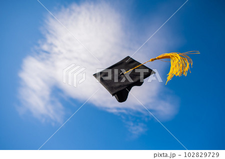 Graduation cap flies against the blue sky. Graduation cap flies against the blue sky. 102829729