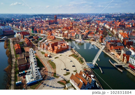 Aerial view of ferris wheel attraction in Gdansk city, Poland. Panoramic view of touristic place in european city Aerial view of ferris wheel attraction in Gdansk city, Poland. Panoramic view of touristic place in european city 102831884