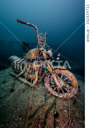 Submerged rusty motorcycle at Tor 13 dive site, Thailand 102834711