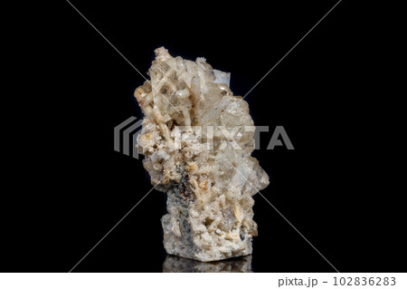 Macro mineral stone fluorite with quartz against black background 102836283