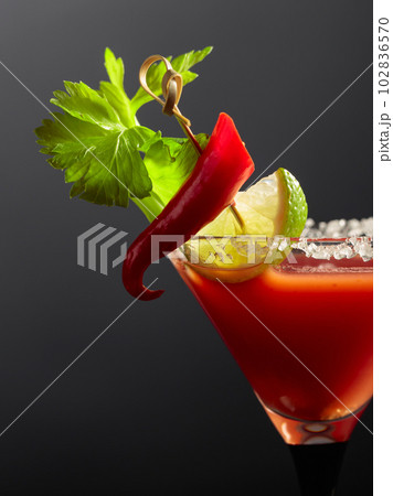 Bloody Mary cocktail with celery, lime, salt, and red pepper. Bloody Mary cocktail with celery, lime, salt, and red pepper. 102836570