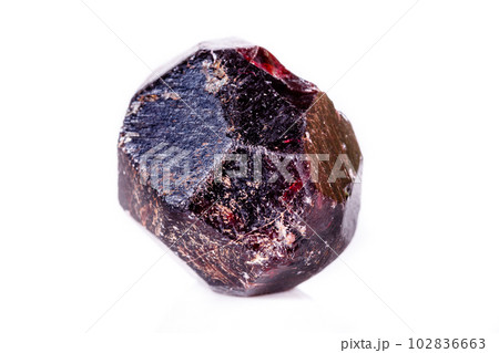 Macro of a mineral garnet stone on a white background 102836663
