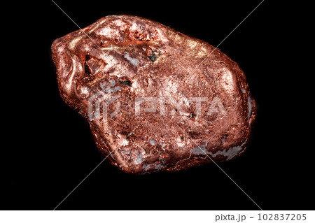 Macro mineral stone of a copper nugget on a microcline on a black background Macro mineral stone of a copper nugget on a microcline on a black background 102837205