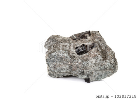 macro mineral stone schorl, black tourmaline on white background macro mineral stone schorl, black tourmaline on white background 102837219