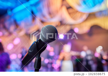 Retro microphone on stage in a pub or American Bar restaurant during a night show. 102838675