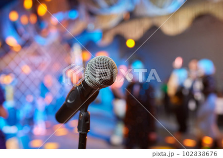Retro microphone on stage in a pub or American Bar restaurant during a night show. 102838676