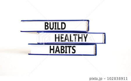 Motivation and Build healthy habits symbol. Concept words Build healthy habits on books on a beautiful white table white background. Business build healthy habits concept. Copy space. 102838911