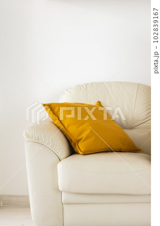 Close-up of patterned beige cushions and small pottery bowl on sofa Stock  Photo - Alamy