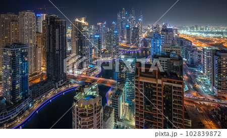 Panorama showing various skyscrapers in tallest recidential block in Dubai Marina aerial night timelapse Panorama showing various skyscrapers in tallest recidential block in Dubai Marina aerial night timelapse 102839872