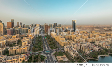 Panorama showing skyscrapers in Barsha Heights district and low rise buildings in Greens district aerial timelapse. Dubai skyline 102839970