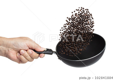 Black Pepper seeds fly throw up in pan, Black Pepper float explode, abstract cloud fly. Black Peppercorn splash throwing in Air. White background Isolated high speed shutter, freeze motion 102841884