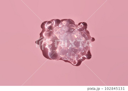 Texture of cosmetic gel on a pink background. 102845131