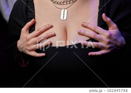 Decollete, female breast. Neckline dress and fur collar. Decollete, female breast. Neckline dress and fur collar. 102845788