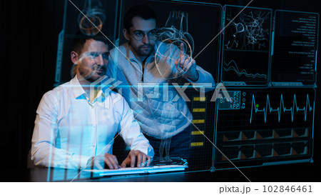Two caucasian bearded men are looking and discussing the data on the virtual menu medical screen. Readings on the life support monitor. Two caucasian bearded men are looking and discussing the data on the virtual menu medical screen. Readings on the life support monitor. 102846461