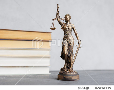 themis goddess of justice statuette, symbol of law with scales and sword in his hands themis goddess of justice statuette, symbol of law with scales and sword in his hands 102848449