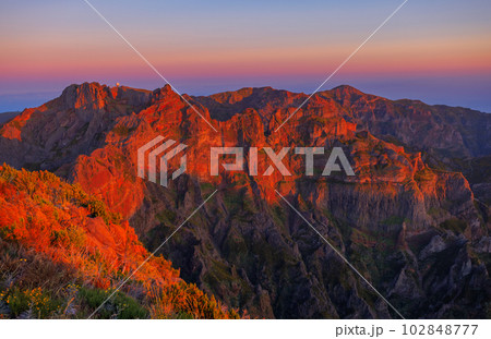 Pico Areeiro mountain peak at Madeira island. Evening view from Ruivo mountain peak. Pico Areeiro mountain peak at Madeira island. Evening view from Ruivo mountain peak. 102848777
