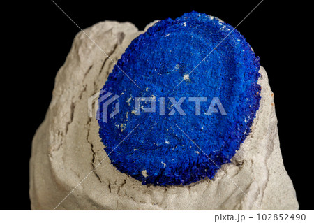 Macro mineral stone Azurite in siltstone against black background Macro mineral stone Azurite in siltstone against black background 102852490