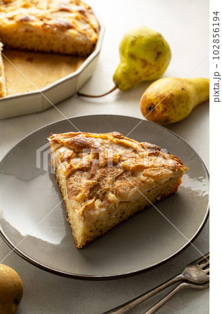 Pear pie. Slice of homemade pear pie, tart with fresh fruits. 102856194