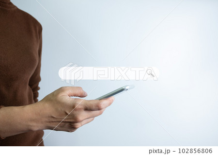 Search Engine optimization SEO concept, Businesswoman is using smartphone to search for information on Internet, Using the search bar, Wireless Network, big data and accessing website information. Search Engine optimization SEO concept, Businesswoman is using smartphone to search for information on Internet, Using the search bar, Wireless Network, big data and accessing website information. 102856806