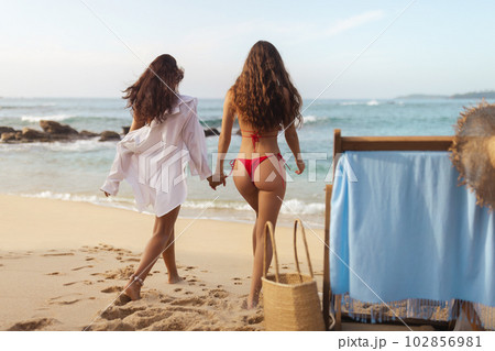 Vacation for Two: Couple of Beach Girls at the Sea Vacation for Two: Couple of Beach Girls at the Sea 102856981