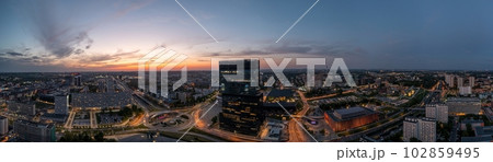 Aerial drone photo of Katowice centre with roundabout and modern office towers at evening. 102859495