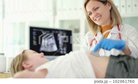 Doctor pediatrician making ultrasound examination of abdominal organs of child in clinic Doctor pediatrician making ultrasound examination of abdominal organs of child in clinic 102861760