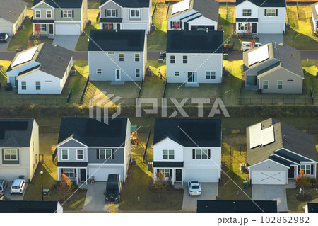 View from above of densely built residential houses in living area in South Carolina. American dream homes as example of real estate development in US suburbs 102862982