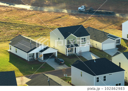 View from above of densely built residential houses in living area in South Carolina. American dream homes as example of real estate development in US suburbs 102862983