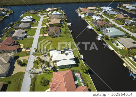 Destroyed by hurricane Ian suburban coastal houses in Florida home residential area. Consequences of natural disaster Destroyed by hurricane Ian suburban coastal houses in Florida home residential area. Consequences of natural disaster 102864014